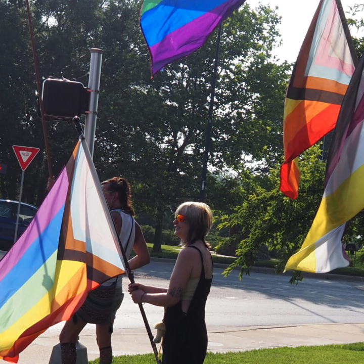  Ahead of SB 180’s implementation, Lawrence campaigners lobby for the city to be made into a sanctuary city for transgender Kansans on June 20, 2023. (Rachel Mipro/Kansas Reflector)