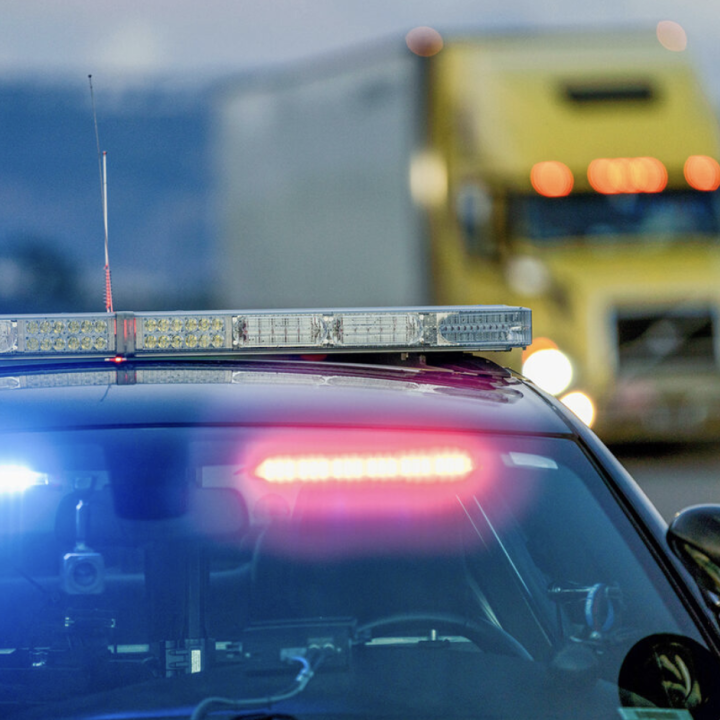 Photo of police car with lights on