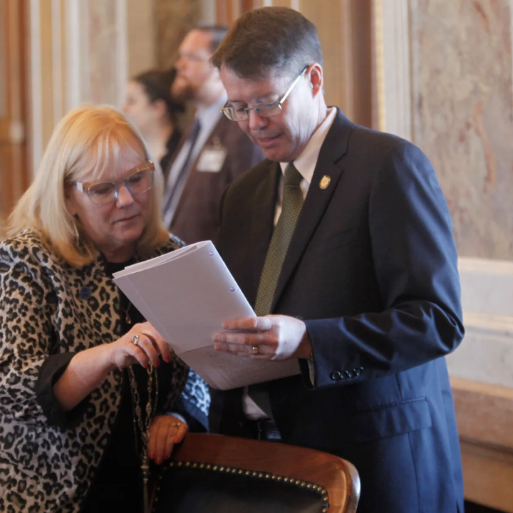 Kansas state Reps. Susan Concannon, left, R-Beloit, and Fred Patton, right, R-Topeka, confer during a session of the House, Thursday, April 6, 2023, at the Statehouse in Topeka, Kan. (JOHN HANNA/AP PHOTO)