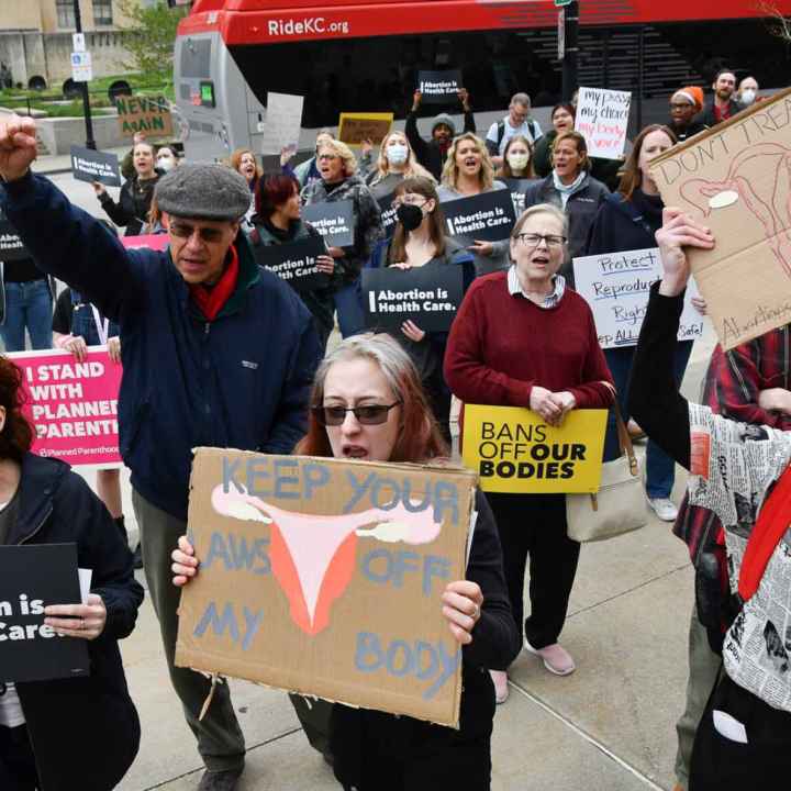 Carlos Moreno / KCUR 89.3 Members of the crowd chant during a rally at the Jackson County Courthouse in Kansas City on Tuesday where protesters gathered to decry the leaked draft opinion by the U.S. Supreme Court indicating the landmark Roe v. Wade case