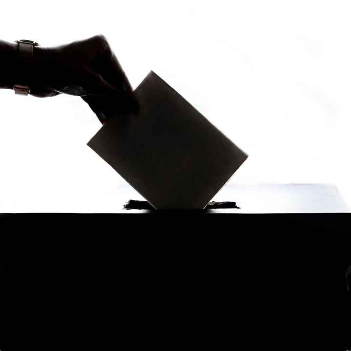 Ballot being dropped into ballot box