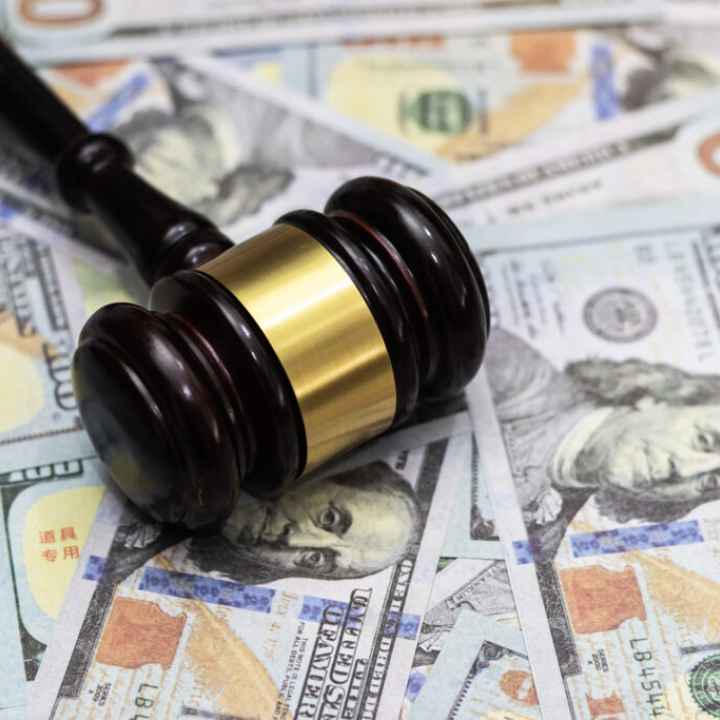 gavel on top of money