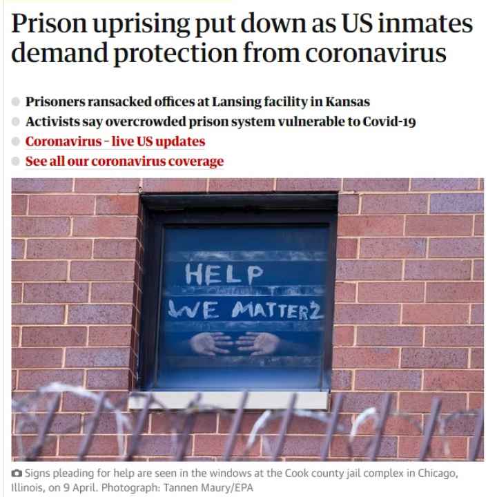 Signs pleading for help are seen in the windows at the Cook county jail complex in Chicago, Illinois, on 9 April. THE GUARDIAN