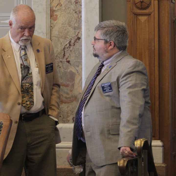 Kansas state Reps. Michael Murphy (left) (R-Sylvia) and Kyle Hoffman (right) (R-Coldwater) confer during a House debate on overriding Democratic Gov. Laura Kelly's veto of a transgender bathroom bill, Thursday, April 27, 2023. | John Hanna/AP Photo